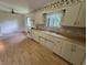 Spacious kitchen featuring a white appliances and wood-look flooring at 7015 Westlake Rd, Indianapolis, IN 46214