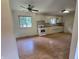 Kitchen area that has white cabinetry, a ceiling fan, and wood-look flooring at 7015 Westlake Rd, Indianapolis, IN 46214