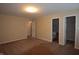 Spacious carpeted bedroom with two closets and neutral paint at 708 Mountain Pine Dr, Greenwood, IN 46143