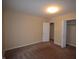 Spacious bedroom with carpet flooring, closet, and neutral walls at 708 Mountain Pine Dr, Greenwood, IN 46143