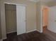 A bedroom featuring neutral walls, carpet, and closet with a sliding door at 708 Mountain Pine Dr, Greenwood, IN 46143