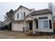 Two story home with neutral siding, two car garage and black shutters at 708 Mountain Pine Dr, Greenwood, IN 46143