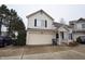 Two story home with neutral siding, two car garage and black shutters at 708 Mountain Pine Dr, Greenwood, IN 46143