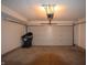 Empty two car garage with white walls and garage door at 708 Mountain Pine Dr, Greenwood, IN 46143