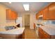 Bright kitchen featuring wood cabinets, neutral countertops, and stainless steel double sink at 708 Mountain Pine Dr, Greenwood, IN 46143