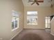 Living room with neutral walls, carpet, and large windows at 708 Mountain Pine Dr, Greenwood, IN 46143