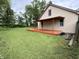Backyard showcasing a covered deck, offering a shaded retreat for relaxation and outdoor enjoyment at 710 Bacon St, Indianapolis, IN 46227