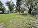 Extensive backyard offering ample space, featuring a deck and a detached garage at 710 Bacon St, Indianapolis, IN 46227