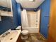Full bathroom with vanity, toilet, and shower tub at 710 Bacon St, Indianapolis, IN 46227