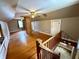 Spacious bonus room with hardwood floors and ceiling fan at 710 Bacon St, Indianapolis, IN 46227