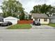 Charming single-Gathering home with a detached garage and a well-maintained front lawn at 710 Bacon St, Indianapolis, IN 46227