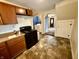 View of the kitchen featuring stove and archway to laundry room at 710 Bacon St, Indianapolis, IN 46227