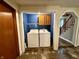 Cozy laundry room with appliances and stairs nearby at 710 Bacon St, Indianapolis, IN 46227