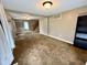 Open living room featuring carpet, neutral paint, staircase and natural light at 710 Bacon St, Indianapolis, IN 46227