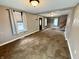 Bright living room with carpet, two windows and neutral paint at 710 Bacon St, Indianapolis, IN 46227
