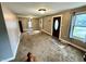 Spacious living room featuring carpet, natural light and neutral paint at 710 Bacon St, Indianapolis, IN 46227