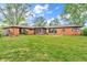 Extensive backyard with a spacious lawn and a clear view of the back of the brick home at 7380 N State Road 267, Brownsburg, IN 46112