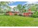 Spacious backyard featuring a brick house, shed, and lush green lawn at 7380 N State Road 267, Brownsburg, IN 46112