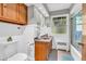 Bathroom featuring a granite countertop, decorative wall cabinet, and tiled floors at 7380 N State Road 267, Brownsburg, IN 46112
