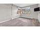 Bedroom with carpeting, corner windows, and a mounted television at 7380 N State Road 267, Brownsburg, IN 46112