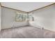 Carpeted bedroom with paneling and two large windows offering abundant natural light at 7380 N State Road 267, Brownsburg, IN 46112