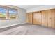 Bedroom with carpeting, large window, and wooden wardrobe at 7380 N State Road 267, Brownsburg, IN 46112