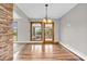 Dining area with hardwood floors and access to backyard porch via glass doors providing ample natural light at 7380 N State Road 267, Brownsburg, IN 46112