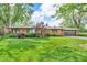 Charming single-story brick home with a lush green lawn and mature trees at 7380 N State Road 267, Brownsburg, IN 46112