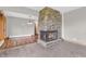 Inviting living space showcasing a stone fireplace and hardwood floors in adjacent dining area at 7380 N State Road 267, Brownsburg, IN 46112