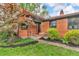 Close-up of a brick home's entrance with attractive landscaping and a tidy yard at 7380 N State Road 267, Brownsburg, IN 46112