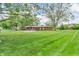 Ranch style home with mature shade trees and expansive front lawn at 7380 N State Road 267, Brownsburg, IN 46112