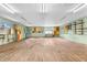 Large flex space with wood floors, wall mounted cabinets, and work bench at 7380 N State Road 267, Brownsburg, IN 46112