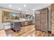 Spacious kitchen with hardwood floors, stainless steel appliances, custom cabinets, and bright natural lighting at 7380 N State Road 267, Brownsburg, IN 46112