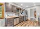 Updated kitchen with stainless appliances, subway tile backsplash, and butcher block countertops and hardwood floors at 7380 N State Road 267, Brownsburg, IN 46112