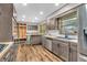 Updated kitchen featuring hardwood floors, stainless appliances, custom storage, butcher block counters and island at 7380 N State Road 267, Brownsburg, IN 46112