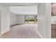 Bright living room with neutral carpet, large windows, and a view of the backyard at 7380 N State Road 267, Brownsburg, IN 46112