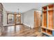 Bright living area with hardwood floors, natural light from backyard access, and custom-built storage at 7380 N State Road 267, Brownsburg, IN 46112