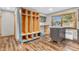 Mudroom with custom-built storage and hardwood floors adjacent to a renovated kitchen space at 7380 N State Road 267, Brownsburg, IN 46112