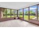 Sunroom with tiled floors and sliding glass windows offering views of backyard at 7380 N State Road 267, Brownsburg, IN 46112