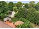 A relaxing deck and gazebo next to a white shed with lush green trees at 7426 N Carroll Rd, Indianapolis, IN 46236