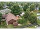 Aerial view of landscaped backyard with gazebo, shed, deck, and mature trees at 7426 N Carroll Rd, Indianapolis, IN 46236