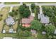 Aerial view of a home with a backyard deck, mature trees, and surrounding neighborhood at 7426 N Carroll Rd, Indianapolis, IN 46236