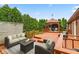A large wooden deck featuring outdoor seating and a gazebo at 7426 N Carroll Rd, Indianapolis, IN 46236