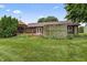 Landscaped backyard featuring a gazebo and a well-maintained lawn at 7426 N Carroll Rd, Indianapolis, IN 46236