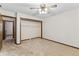 Spacious bedroom with neutral carpet, trim, and an open closet for storage at 7426 N Carroll Rd, Indianapolis, IN 46236