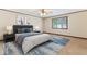 A virtually staged bedroom has neutral colors and minimalist decor at 7426 N Carroll Rd, Indianapolis, IN 46236