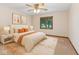 Cozy bedroom staged with a bed, neutral walls, carpet, and window with natural light at 7426 N Carroll Rd, Indianapolis, IN 46236