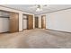 Spacious bedroom with neutral carpet, trim, and multiple closets for storage at 7426 N Carroll Rd, Indianapolis, IN 46236