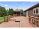 Expansive wooden deck featuring a charming gazebo and well-maintained backyard, perfect for outdoor living at 7426 N Carroll Rd, Indianapolis, IN 46236