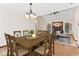 Dining room showcasing a wooden table with seating for eight with access to the living room at 7426 N Carroll Rd, Indianapolis, IN 46236